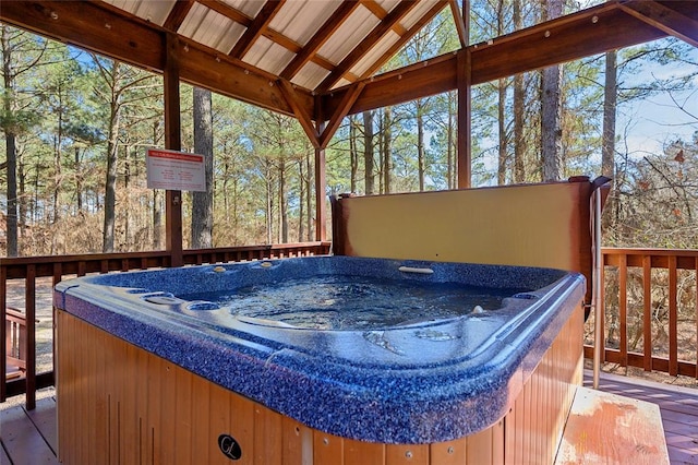 deck featuring a hot tub