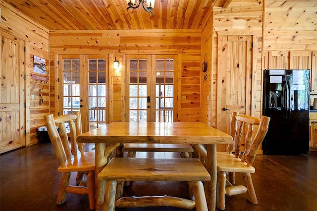 dining room featuring wood ceiling, french doors, a healthy amount of sunlight, and dark hardwood / wood-style floors