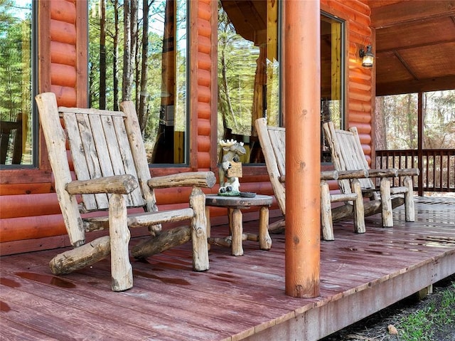 wooden terrace with an outbuilding and an exterior structure