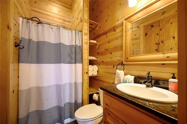 full bathroom with toilet, wood walls, a shower with shower curtain, and vanity