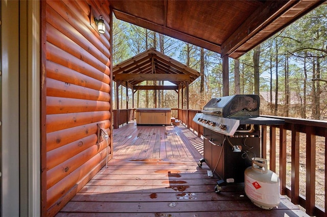 wooden terrace with a gazebo and grilling area