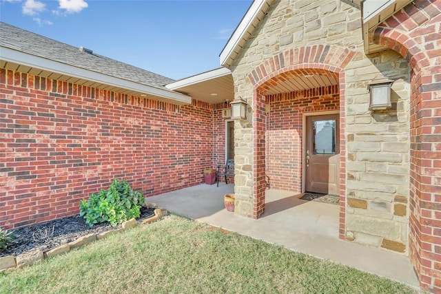 doorway to property with a patio area