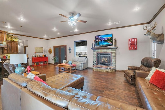 11335 N 1930th Rd, Sayre, OK 73662 - living area featuring ornamental molding, a ceiling fan, wood finished floors, recessed lighting, and a stone fireplace