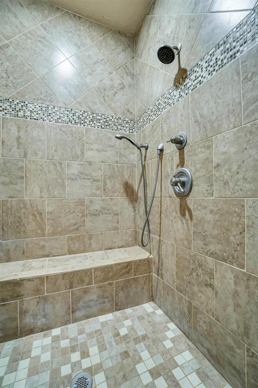 bathroom with a tile shower