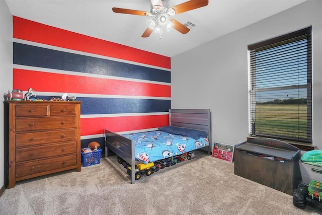 bedroom featuring ceiling fan and light colored carpet