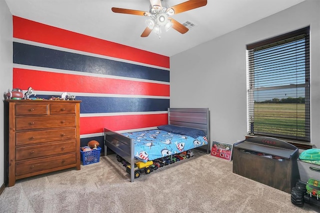 11335 N 1930th Rd, Sayre, OK 73662 - carpeted bedroom featuring a ceiling fan