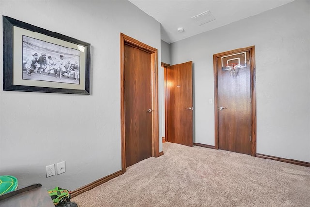 unfurnished bedroom with carpet floors