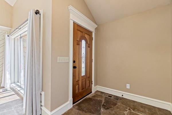 foyer featuring lofted ceiling