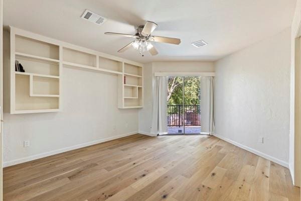 empty room featuring ceiling fan and wood-type flooring