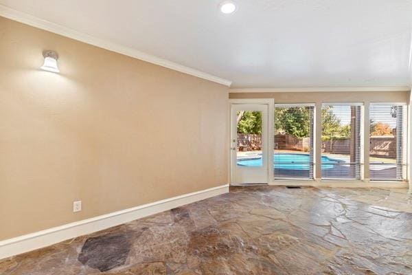 unfurnished room featuring crown molding