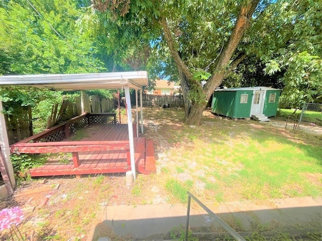 view of yard with an outbuilding and a deck