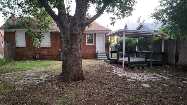 exterior space featuring cooling unit and a deck