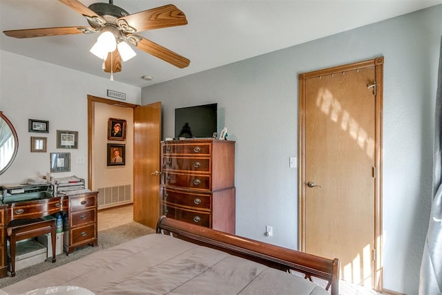 bedroom featuring light carpet and ceiling fan