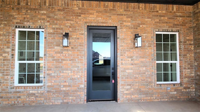 9321 SW 35th St, Oklahoma City, OK 73179 - view of exterior entry featuring brick siding