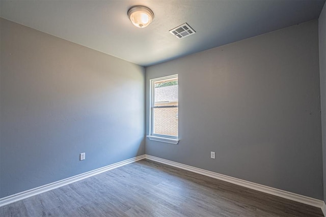 unfurnished room featuring hardwood / wood-style flooring