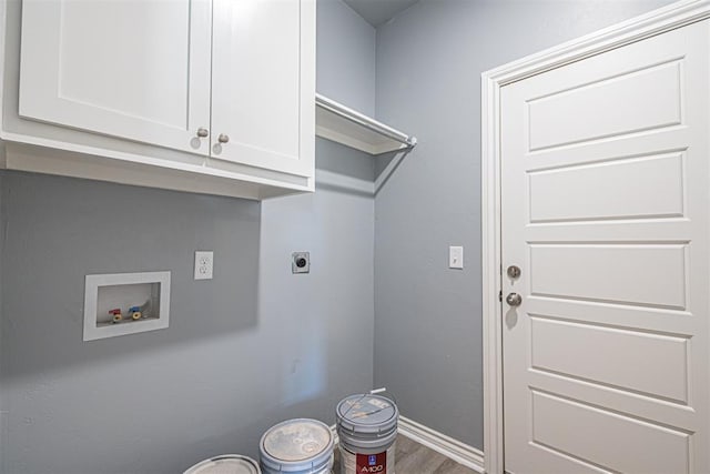 laundry room featuring hardwood / wood-style flooring, hookup for a washing machine, cabinets, and hookup for an electric dryer