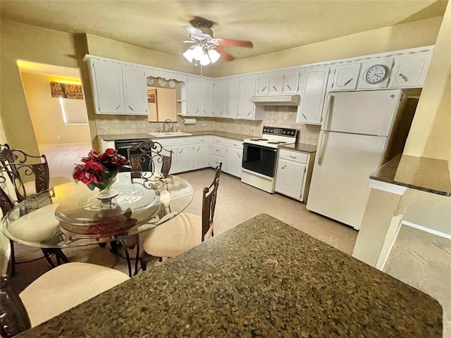 kitchen featuring decorative backsplash, white cabinetry, sink, and white appliances