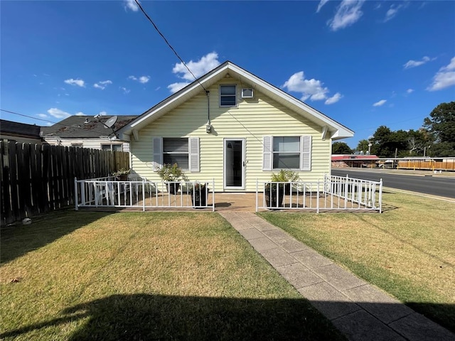 back of property with a yard and a patio area