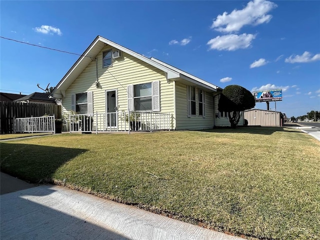 view of side of property featuring a lawn