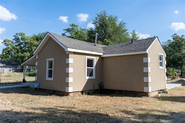 view of property exterior with a yard