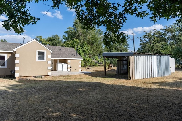 rear view of house featuring a lawn