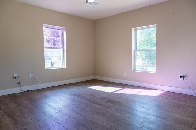 empty room featuring dark hardwood / wood-style floors