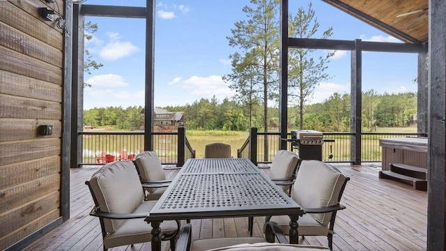 sunroom with wooden ceiling and vaulted ceiling