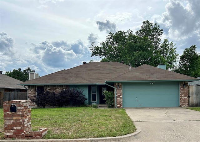 ranch-style home with a garage and a front lawn