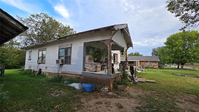 618 S Wewoka Ave, Wewoka, OK 74884 - view of side of home with cooling unit and a yard