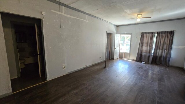 618 S Wewoka Ave, Wewoka, OK 74884 - unfurnished room with ceiling fan, dark wood-type flooring, and ornamental molding