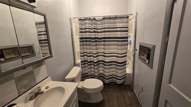 618 S Wewoka Ave, Wewoka, OK 74884 - full bathroom featuring toilet, shower / bath combo with shower curtain, vanity, and hardwood / wood-style flooring