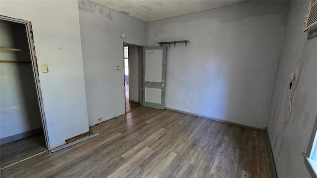 618 S Wewoka Ave, Wewoka, OK 74884 - unfurnished bedroom with dark hardwood / wood-style flooring and a closet