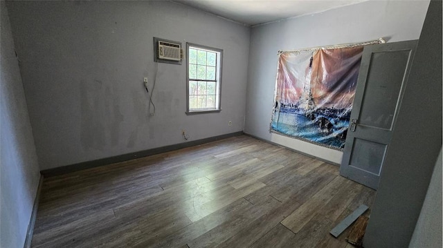 618 S Wewoka Ave, Wewoka, OK 74884 - empty room featuring hardwood / wood-style floors and a wall mounted AC