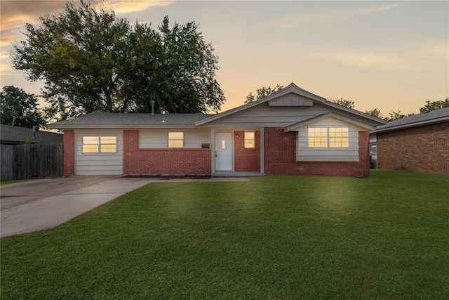 ranch-style house with a yard