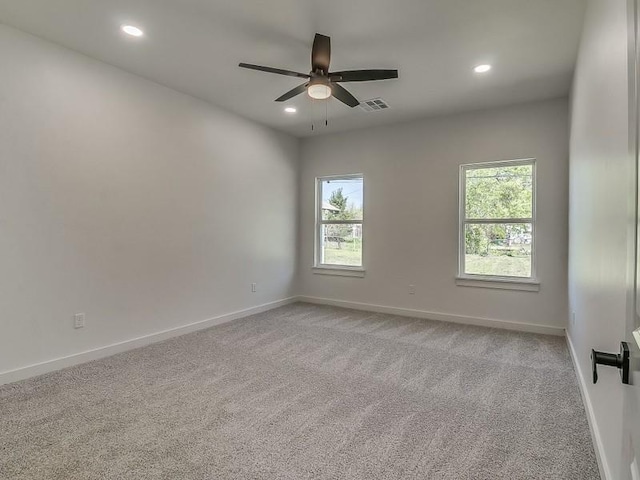 carpeted empty room with ceiling fan