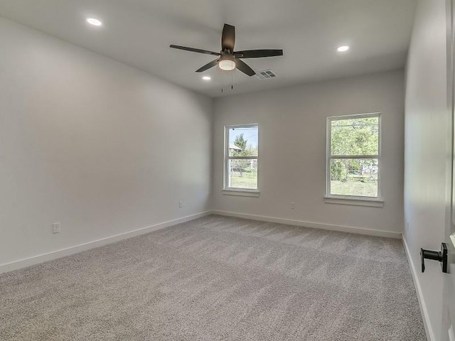 1213 SW 23rd St, Oklahoma City, OK 73109 - spare room featuring light colored carpet, a ceiling fan, and recessed lighting