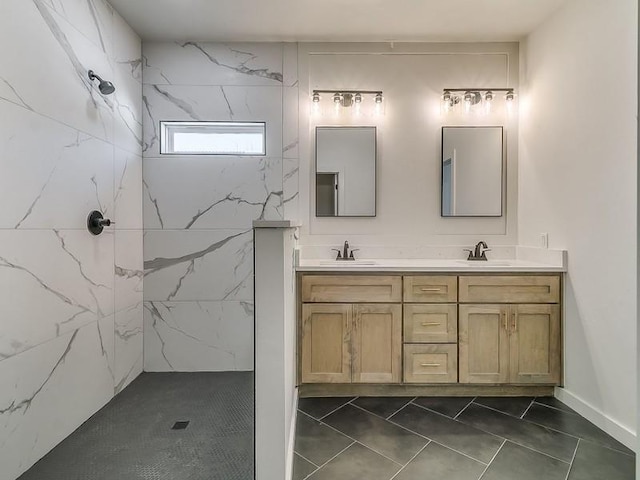 bathroom featuring tile patterned floors, vanity, and a shower