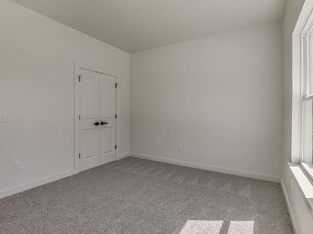 empty room with carpet flooring