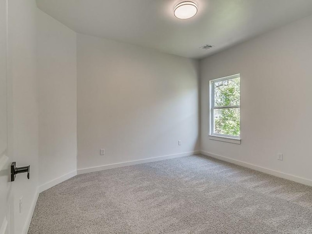 empty room featuring carpet floors