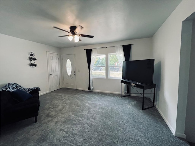 living room with dark colored carpet and ceiling fan