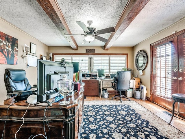 office featuring hardwood / wood-style floors, a textured ceiling, and a wealth of natural light