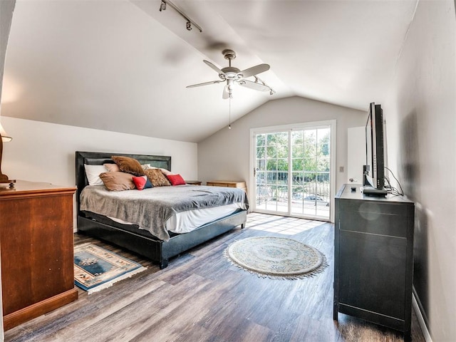 bedroom featuring access to exterior, ceiling fan, vaulted ceiling, and hardwood / wood-style flooring