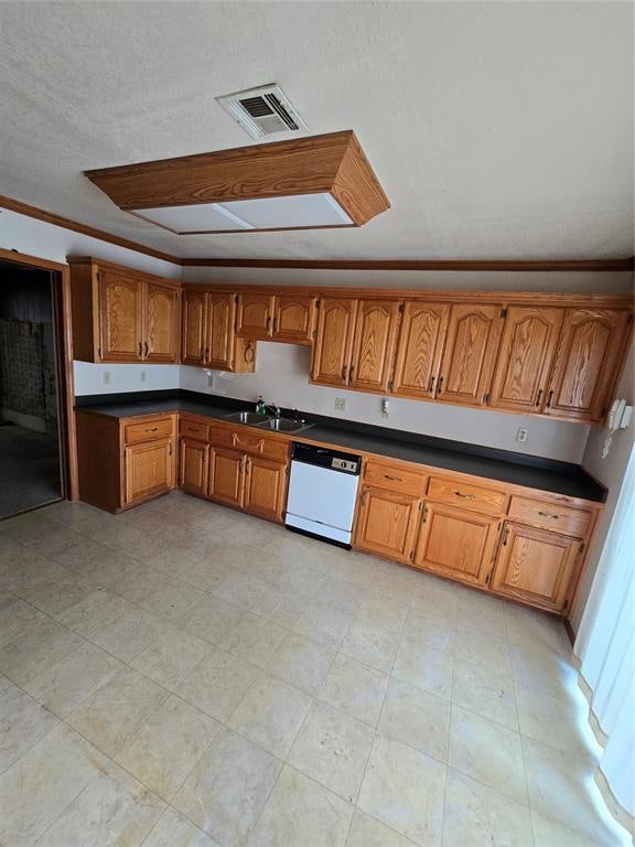 kitchen featuring white dishwasher, crown molding, sink, and a textured ceiling