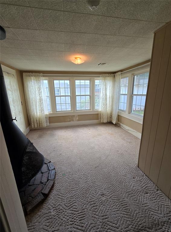 sitting room featuring light colored carpet