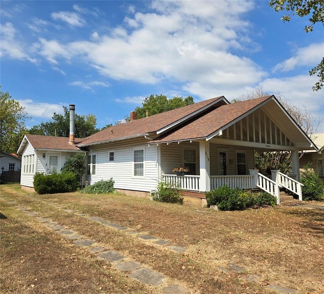 back of house with covered porch