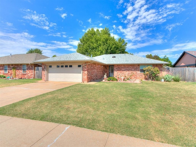 single story home featuring a front yard and a garage