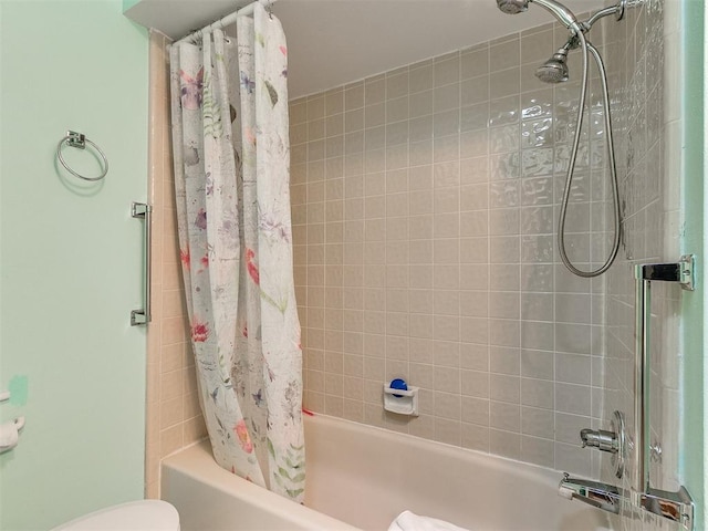 bathroom with toilet and shower / bathtub combination with curtain