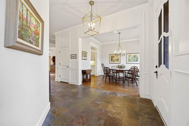 dining room featuring ornamental molding and a chandelier