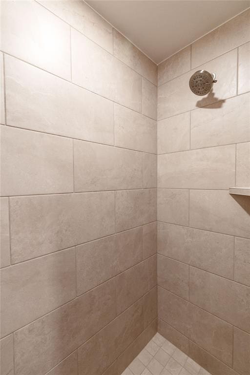 full bath featuring tiled shower