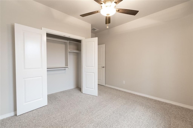 unfurnished bedroom featuring light carpet, baseboards, visible vents, and a closet